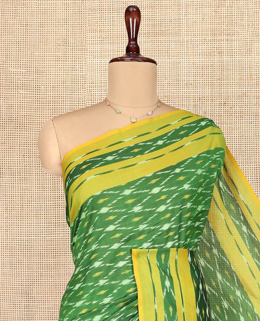 Green Ikkat Cotton Saree, Ornamented with Ikkat-Style Jaal-Patterns on Its Body, Complemented by Contrast Ikkat Border, Pallu of Jaal Designs, and Has No Blouse
