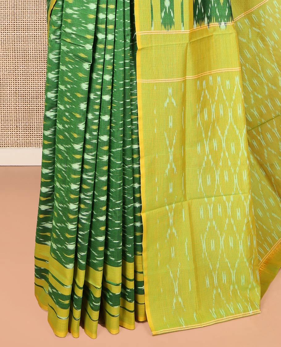 Green Ikkat Cotton Saree, Ornamented with Ikkat-Style Jaal-Patterns on Its Body, Complemented by Contrast Ikkat Border, Pallu of Jaal Designs, and Has No Blouse