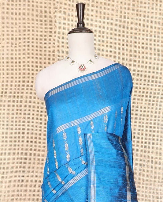 Blue Dupion Silk Saree, Graced with Floral Buttas All Over Its Body, Complemented by a Zari Striped Border, Sparsely Woven Pallu of Intricate Geometric Patterns, and Paired with a Matching Blouse