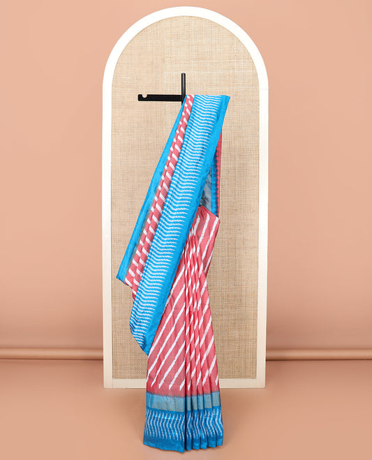 Pink Ikkat Silk Saree Features Lehariya Stripes in Ikkat Weave, Complemented by a Contrast Ikkat Textured Border, Subtly Woven Pallu of Jaal Design, and a Contrast Plain Blouse
