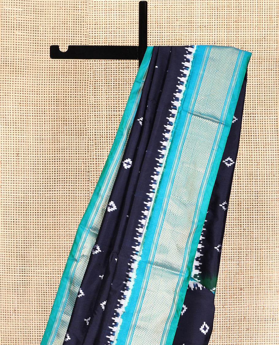 Blue Pochampally Ikat Silk Saree, Accentuated with Ikkat Buttas on Its Body, Complemented by Contrast Temple Traditional Design Border, Pallu of Intricate Patterns, and Paired with a Contrast Blouse
