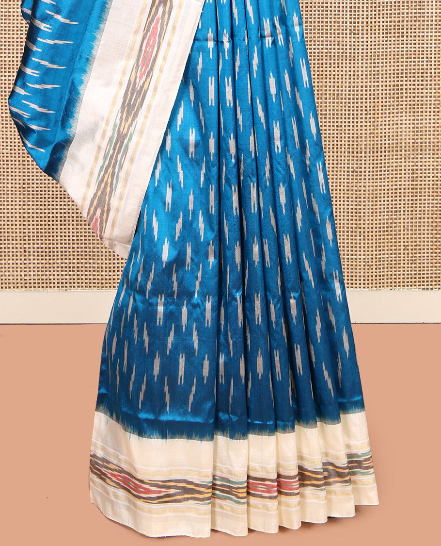 Blue Pochampally Ikat Silk Saree, Ornamented with Ikat Buttas, Complemented by a Contrast Ikat Border, Ikat-Style Pallu, and No Blouse