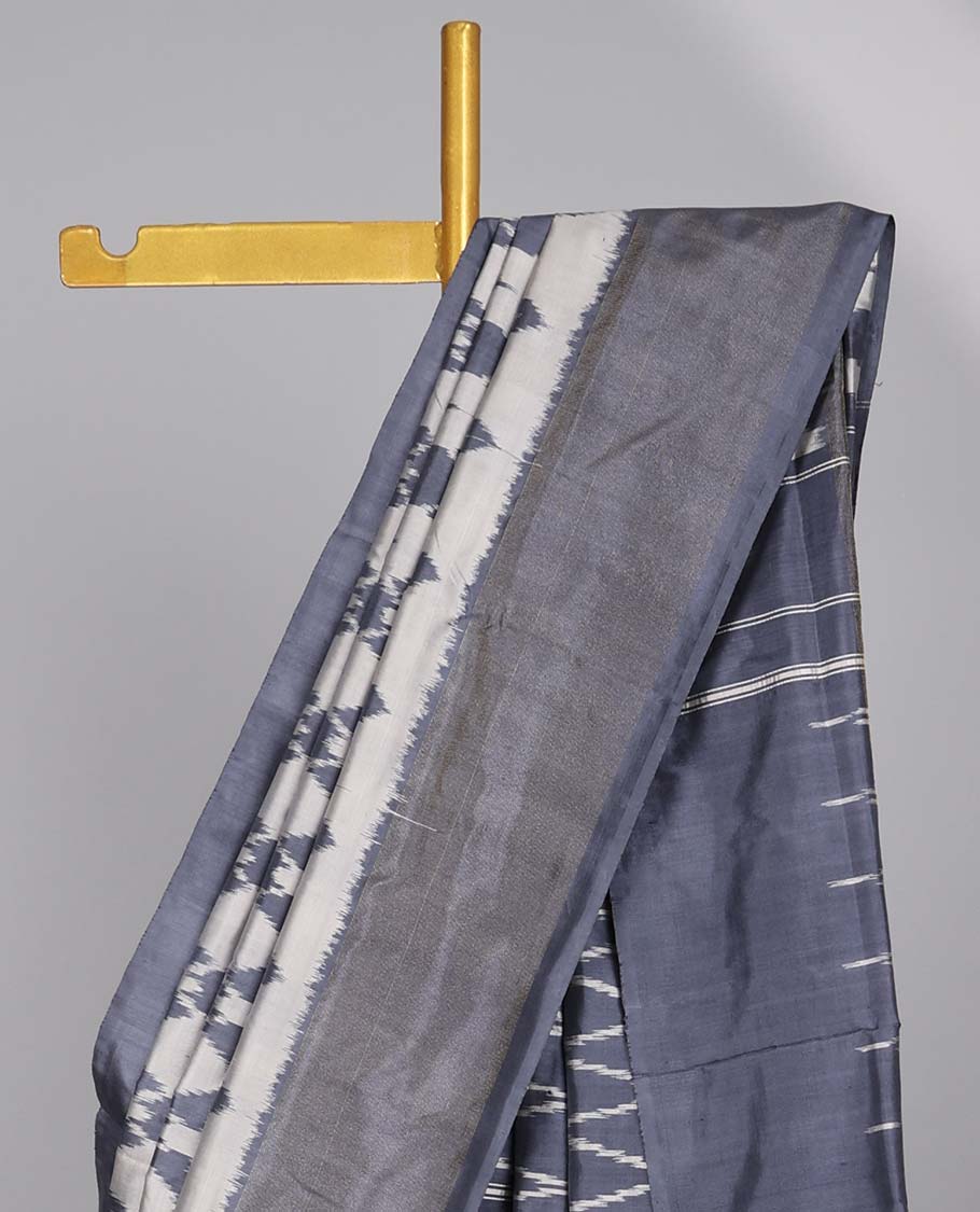 Grey ogee design ikkat silk saree with contrat plain border & argyle design pallu