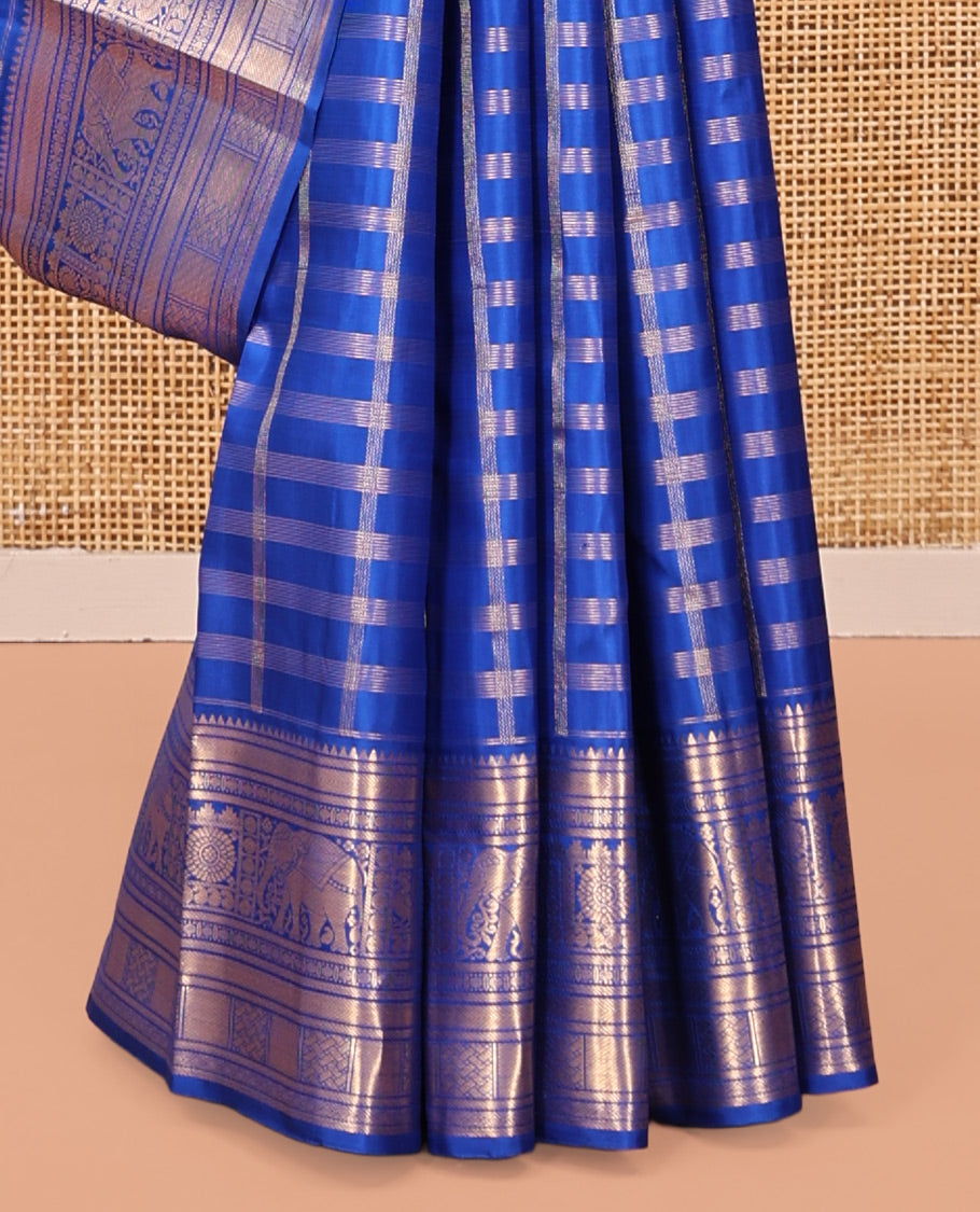 Blue Kanchipuram Silk Saree, Adorned with Zari Buttas and Checks, a Zari Border of Rekku, Kathir, Muthu, Rudraksham, Rekku, Yaanai, Chakram, and Paiyaddi Kattam, Jaal Pallu, Matching Blouse