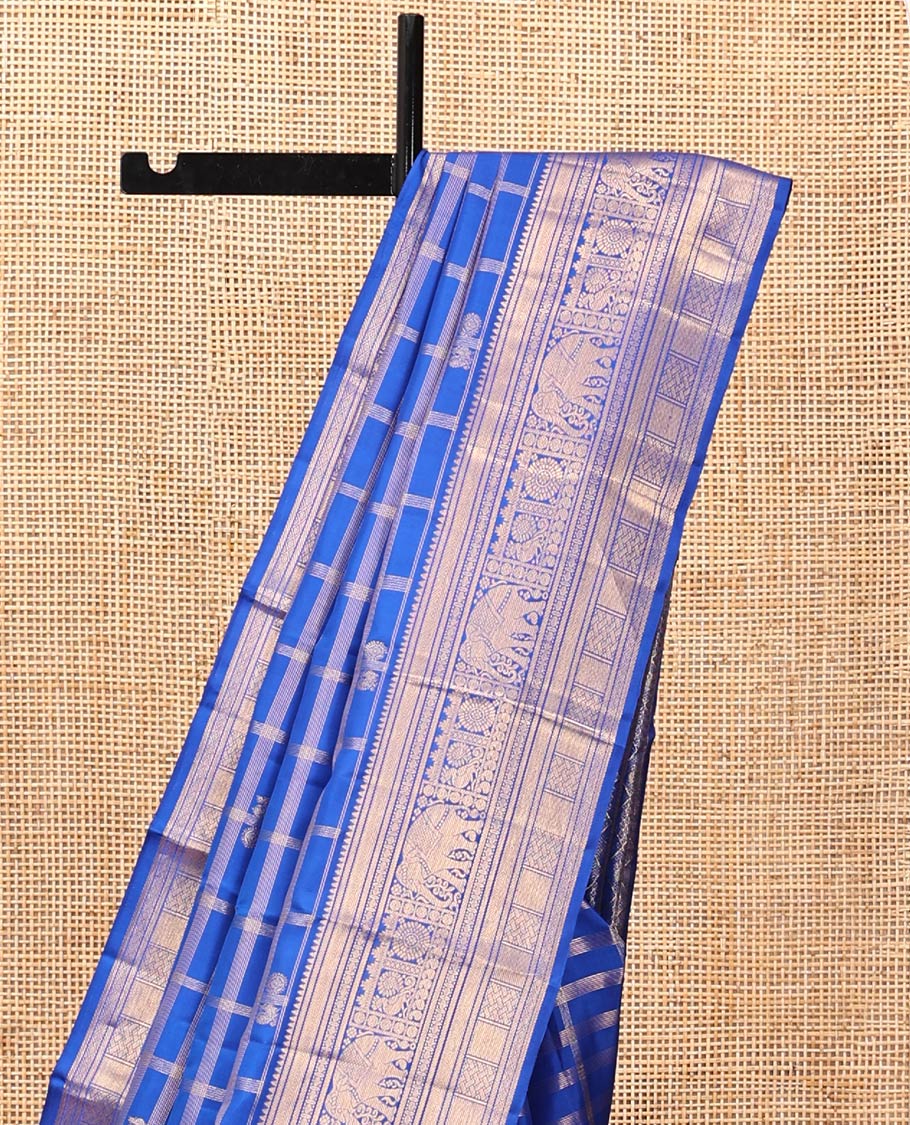 Blue Kanchipuram Silk Saree, Adorned with Zari Buttas and Checks, a Zari Border of Rekku, Kathir, Muthu, Rudraksham, Rekku, Yaanai, Chakram, and Paiyaddi Kattam, Jaal Pallu, Matching Blouse