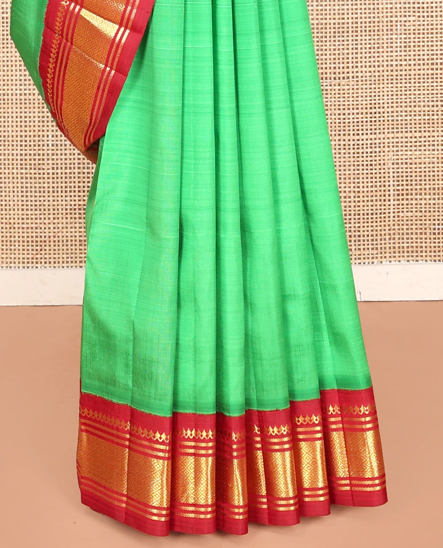 Green Kanchipuram Silk Saree, Decorated with Zari Buttas, Contrast Korvai Border of Thilakam Mokku, Banaras, and Mayil Kann, Pallu of Zari Design, and No Blouse