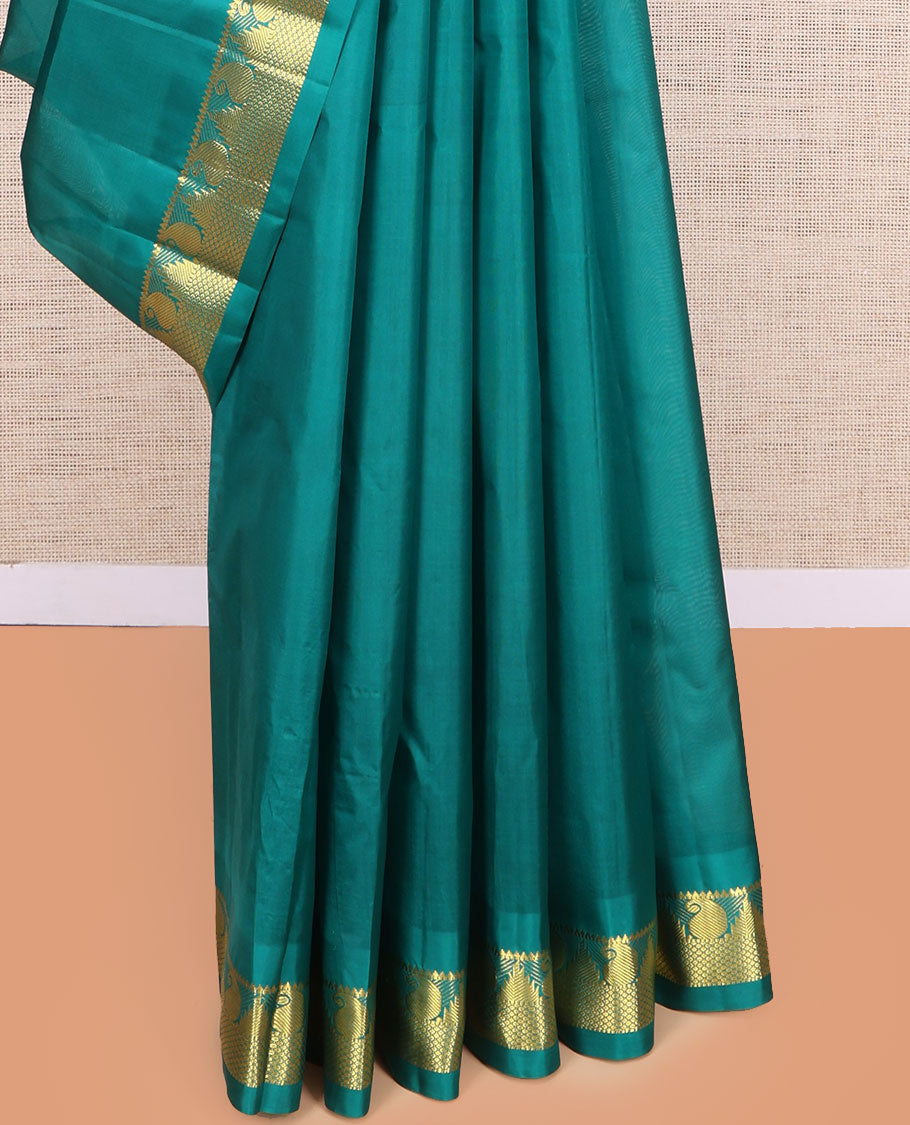 Green Kanchipuram Silk Saree, Woven with Zari Buttas, Highlighted by Zari Border of Rekku, Muthu, Manga, and Mayil Kann Designs, Pallu of Zari Design, and a Matching Blouse