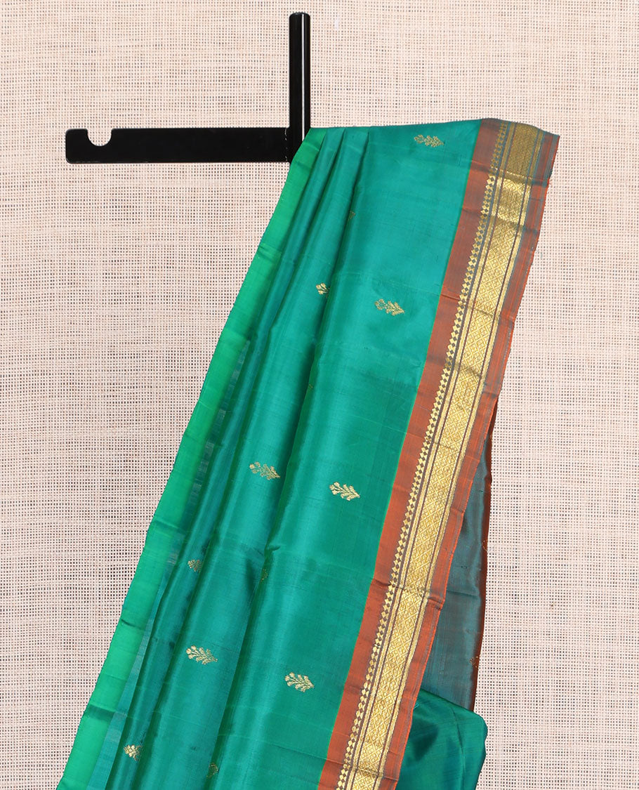 Green Kanchipuram Silk Saree, Woven with Zari Buttas, a Contrast One-Sided Border of Panner Sombu, Banaras, and Jaal Designs, Zari Design Pallu, and No Blouse