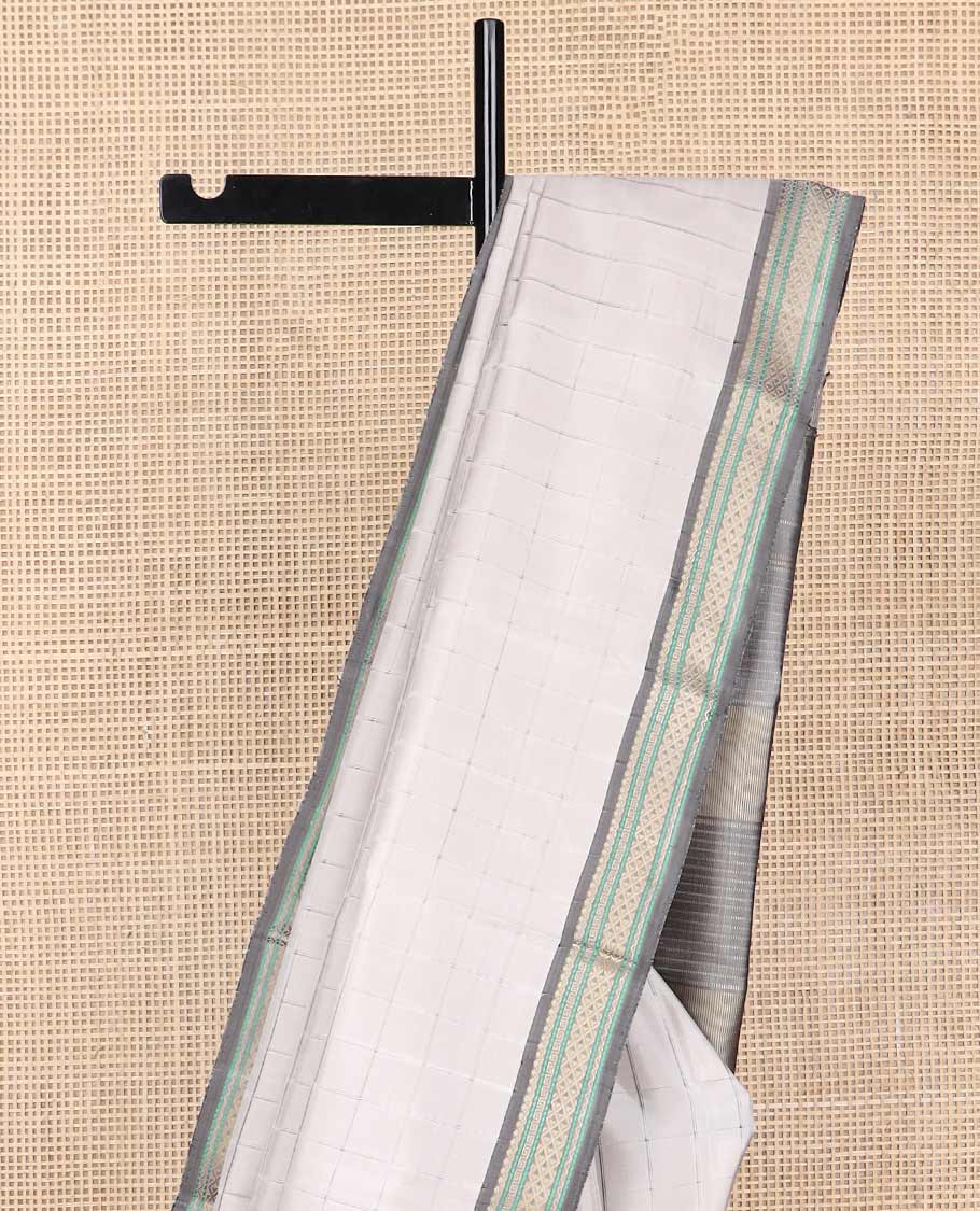 Light grey checked kancheepuram silk saree with contrast intricate design border & striped pallu