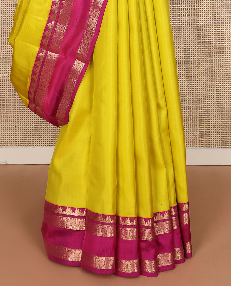 Yellow plain Kanchipuram silk saree, contrast rettai pettu border of thazampoo rekku, neli, chakram & kuthirai & jaal pallu