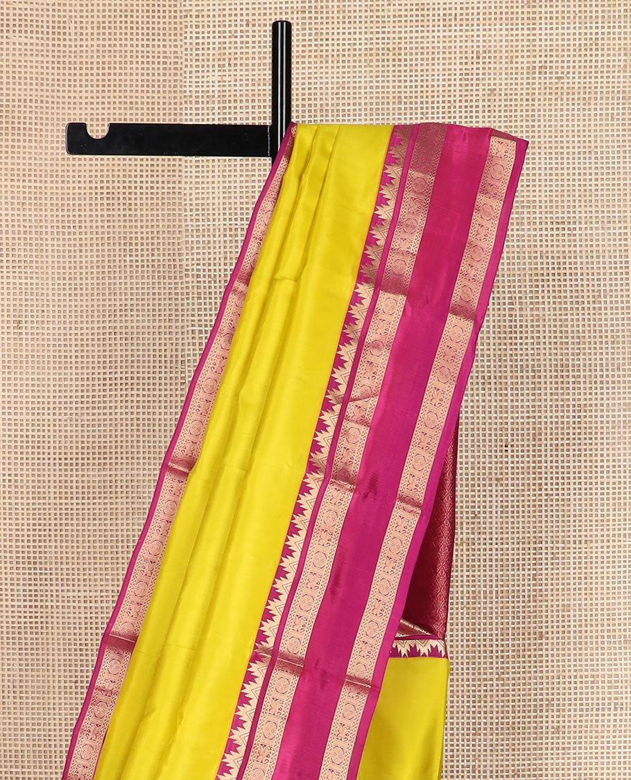 Yellow plain Kanchipuram silk saree, contrast rettai pettu border of thazampoo rekku, neli, chakram & kuthirai & jaal pallu