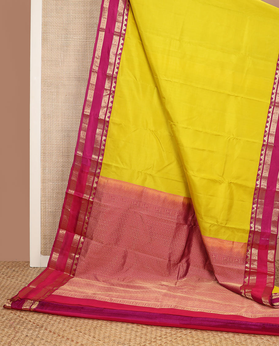 Yellow plain Kanchipuram silk saree, contrast rettai pettu border of thazampoo rekku, neli, chakram & kuthirai & jaal pallu