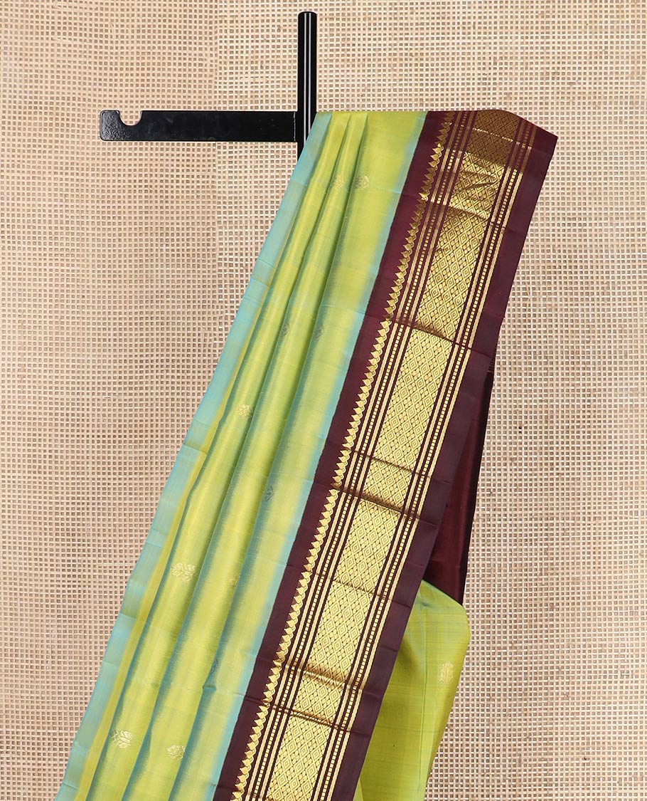 Green zari buttas silk saree, contrast korvai one-sided border of thilakam mokku,muthu,banaras & jaal & zari design pallu