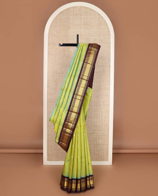 Green zari buttas silk saree, contrast korvai one-sided border of thilakam mokku,muthu,banaras & jaal & zari design pallu