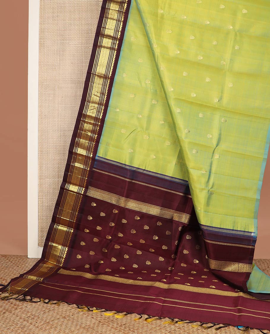 Green zari buttas silk saree, contrast korvai one-sided border of thilakam mokku,muthu,banaras & jaal & zari design pallu