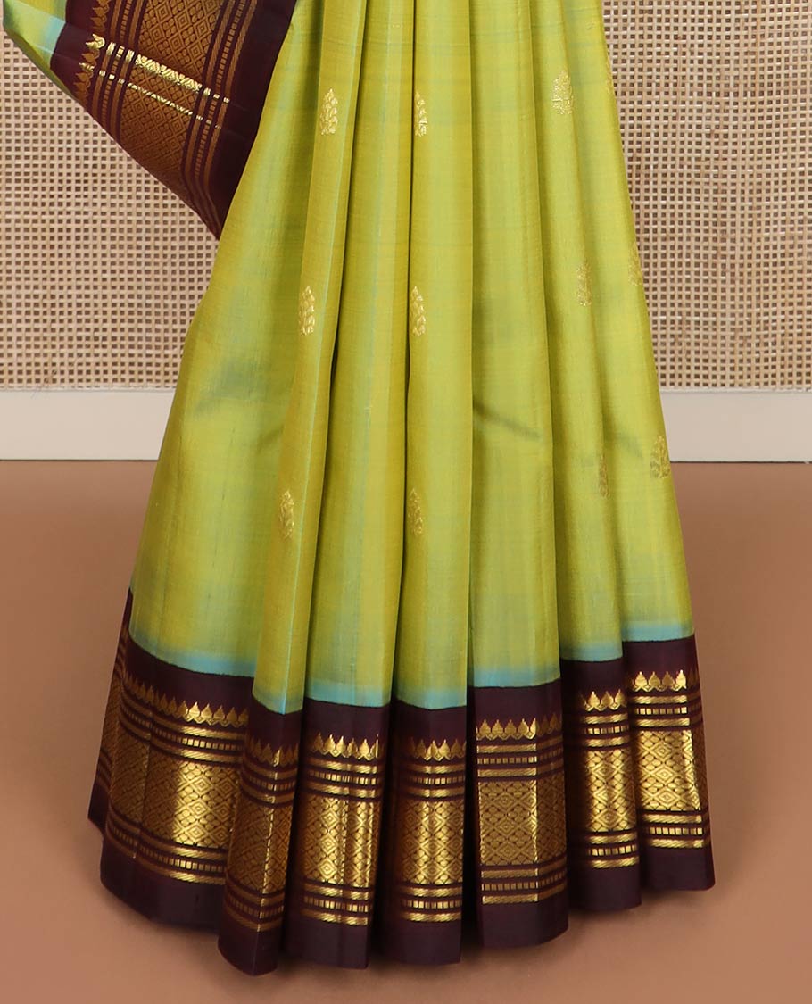 Green zari buttas silk saree, contrast korvai one-sided border of thilakam mokku,muthu,banaras & jaal & zari design pallu