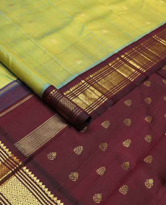 Green zari buttas silk saree, contrast korvai one-sided border of thilakam mokku,muthu,banaras & jaal & zari design pallu