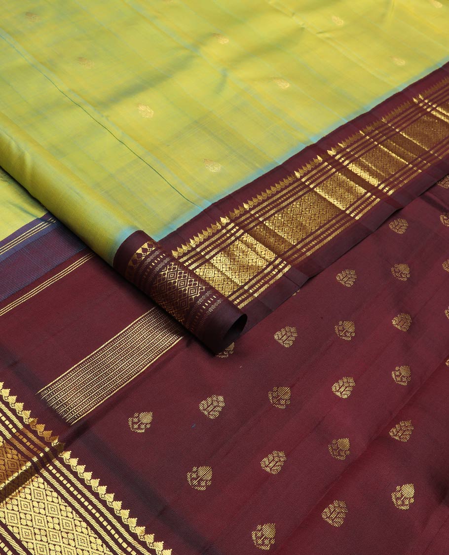 Green zari buttas silk saree, contrast korvai one-sided border of thilakam mokku,muthu,banaras & jaal & zari design pallu