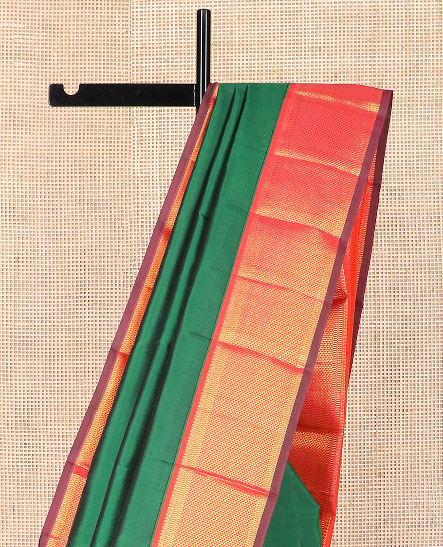 Green plain Kanchipuram silk saree, contrast border of thilakam mokku, muthu, banaras, and ara maadam designs, and ara maadam design pallu