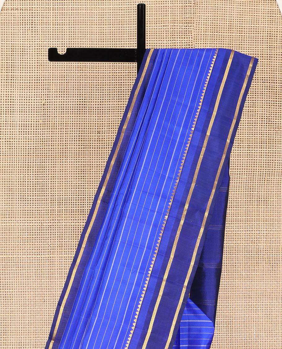 Blue Kanchipuram Silk Saree, Elevated with Stripes All Over Its Body, Complemented by Contrast Temple Zari Border, Subtly Zari-Striped Pallu, and Paired with a Contrast Blouse
