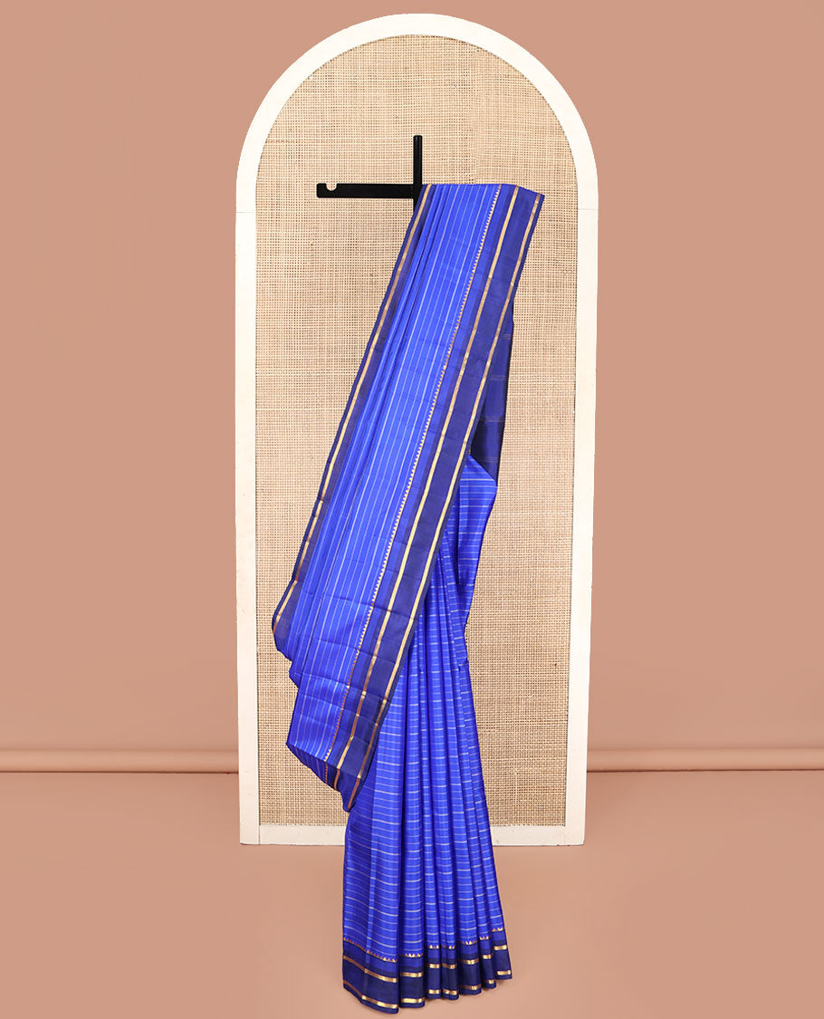 Blue Kanchipuram Silk Saree, Elevated with Stripes All Over Its Body, Complemented by Contrast Temple Zari Border, Subtly Zari-Striped Pallu, and Paired with a Contrast Blouse