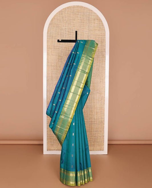 Blue kancheepuram silk saree with zari buttas, contrast one-sided border of rekku, mayil kann & muthu designs & zari design pallu