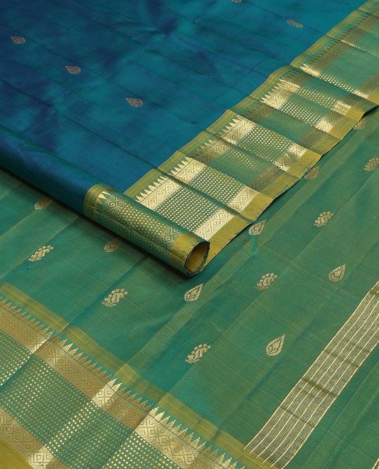 Blue kancheepuram silk saree with zari buttas, contrast one-sided border of rekku, mayil kann & muthu designs & zari design pallu