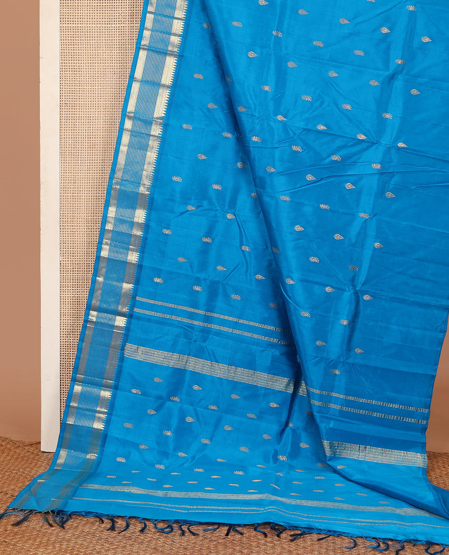 Blue zari buttas Kanchipuram silk saree, one-sided zari border of rekku, banaras, diamond, and muthu designs , and zari design pallu