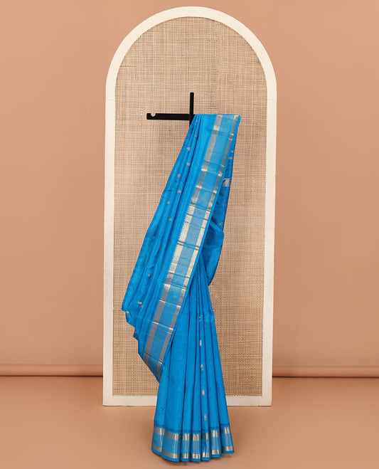 Blue zari buttas Kanchipuram silk saree, one-sided zari border of rekku, banaras, diamond, and muthu designs , and zari design pallu