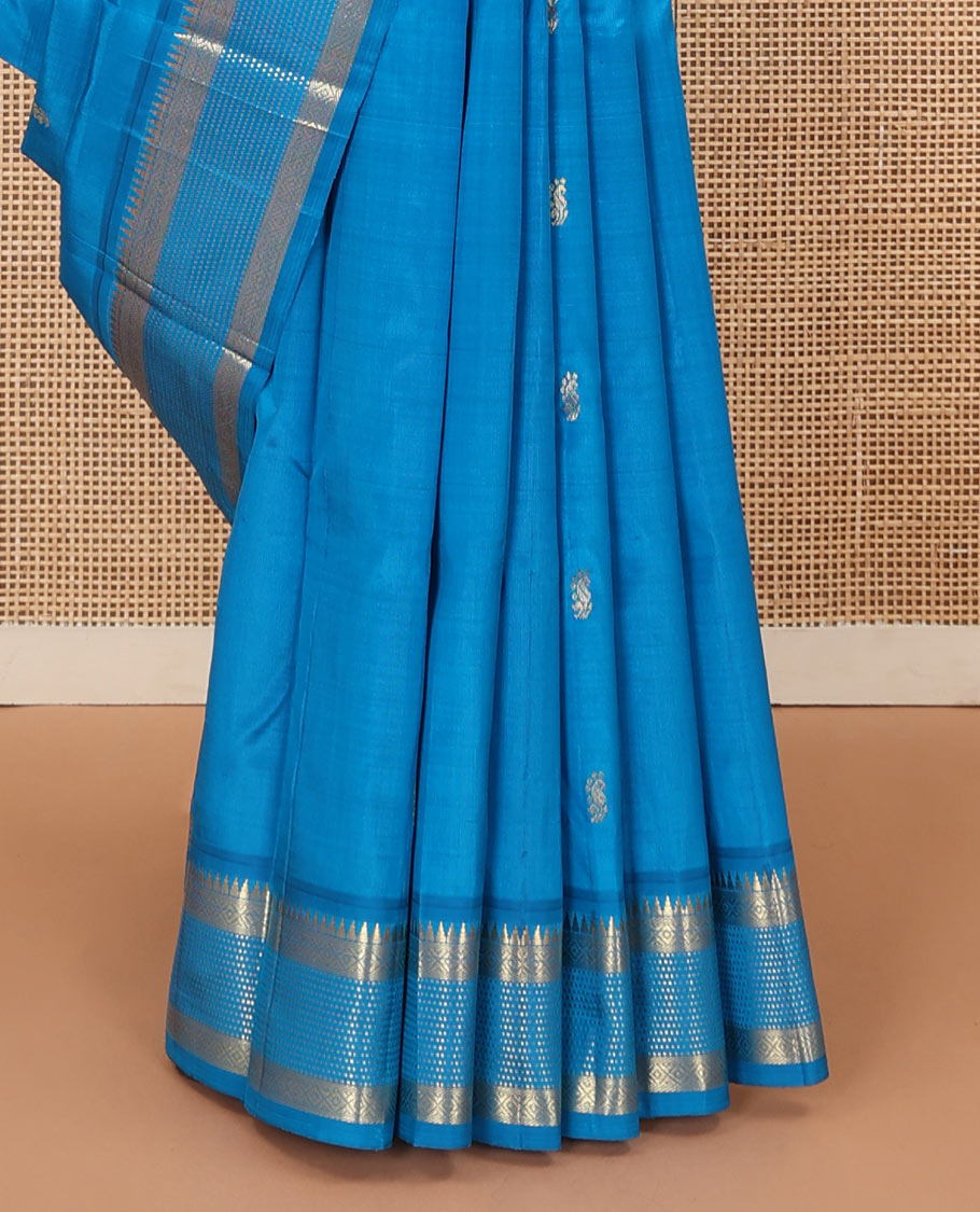 Blue zari buttas Kanchipuram silk saree, one-sided zari border of rekku, banaras, diamond, and muthu designs , and zari design pallu