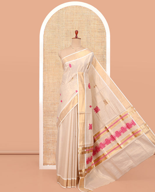 Cream Kerala Cotton Saree, Spotlighted with Thread and Zari Buttas All Over Its Body, a Zari Bavanji Border, Pallu of Elephant Designs, and Paired with a Matching Blouse