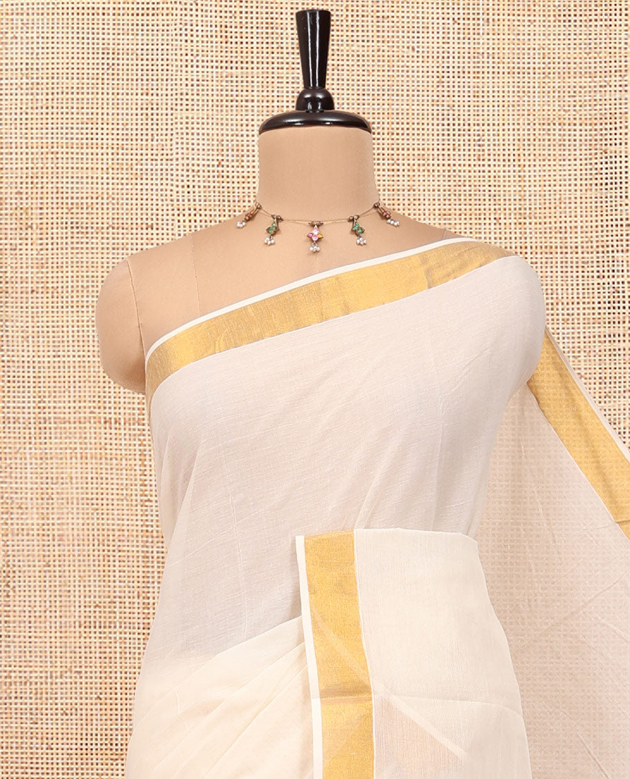 Cream Kerala Cotton Saree, Beautified with Zari Buttas All Over Its Body, a Subtle Bavanji Border, Pallu Features Stripes and Buttas, and Is Paired with a Matching Blouse