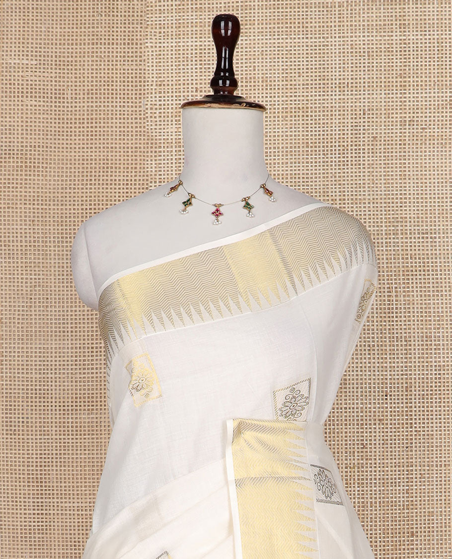 Cream zari buttas Kerala saree, temple zari border, and pallu of intricate zari designs