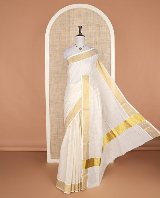 Cream zari checked Kerala cotton saree, zari border, and zari checked design pallu