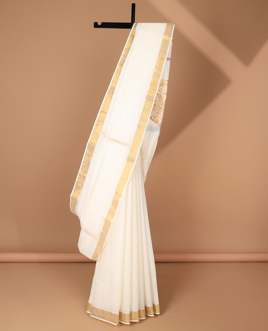 Cream kerala saree features zari designs, zari border & pallu of intricate zari designs