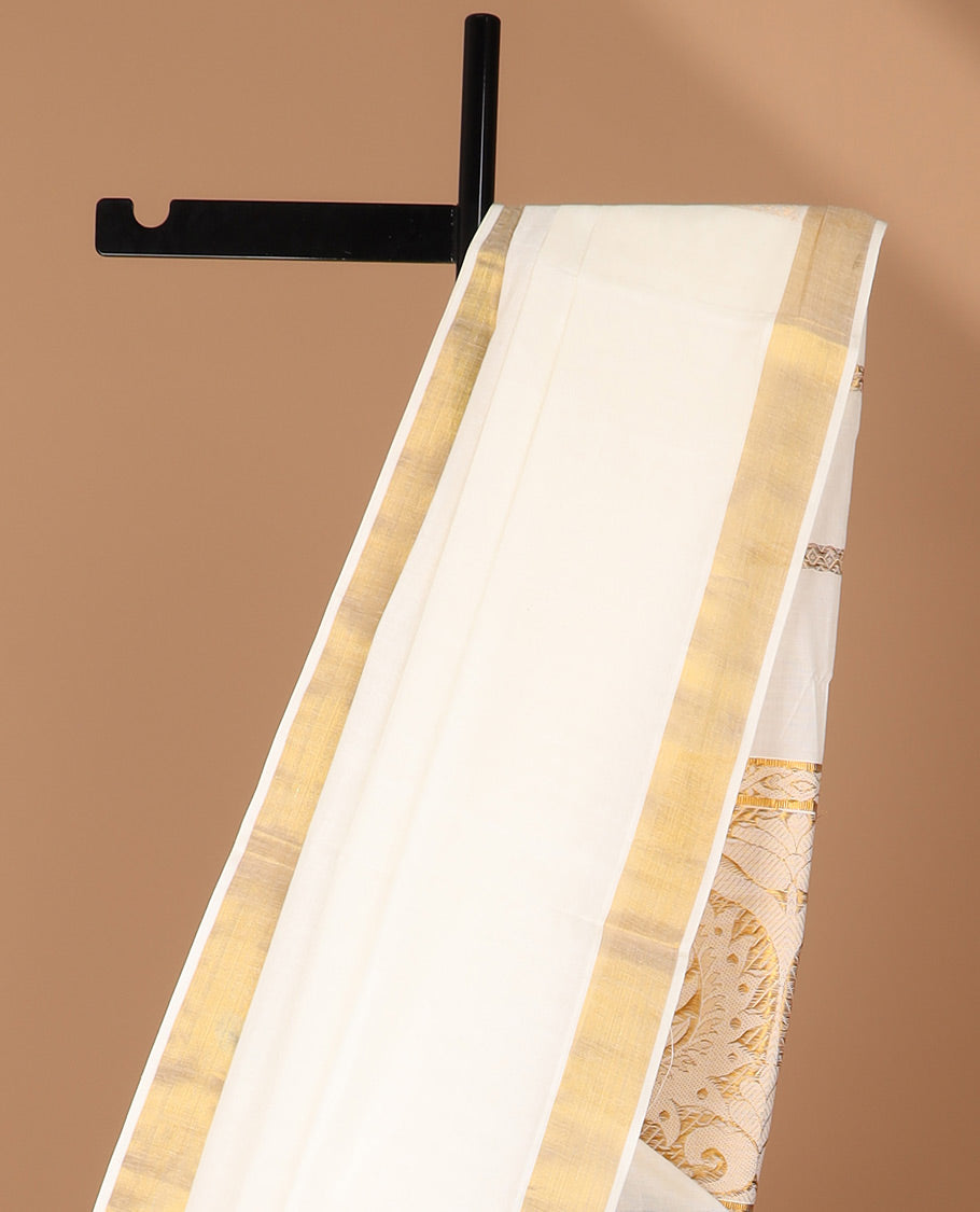 Cream kerala saree features zari designs, zari border & pallu of intricate zari designs