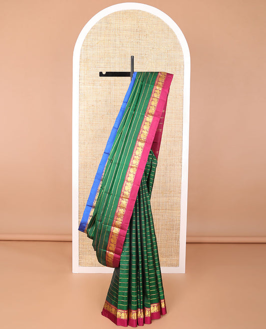 Green striped kancheepuram silk saree with contrast ganga jamuna border of paisley, mayil design & zari design pallu