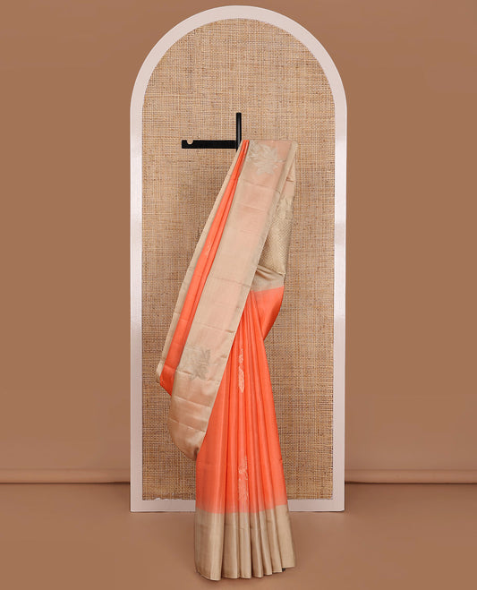 Orange Mayuri Soft Silk Saree, Majestically Detailed with Floral Buttas All Over Its Body, Complemented by Contrast Border of Floral Designs, Pallu of Sparsely Woven Intricate Designs, and Paired with a Contrast Blouse