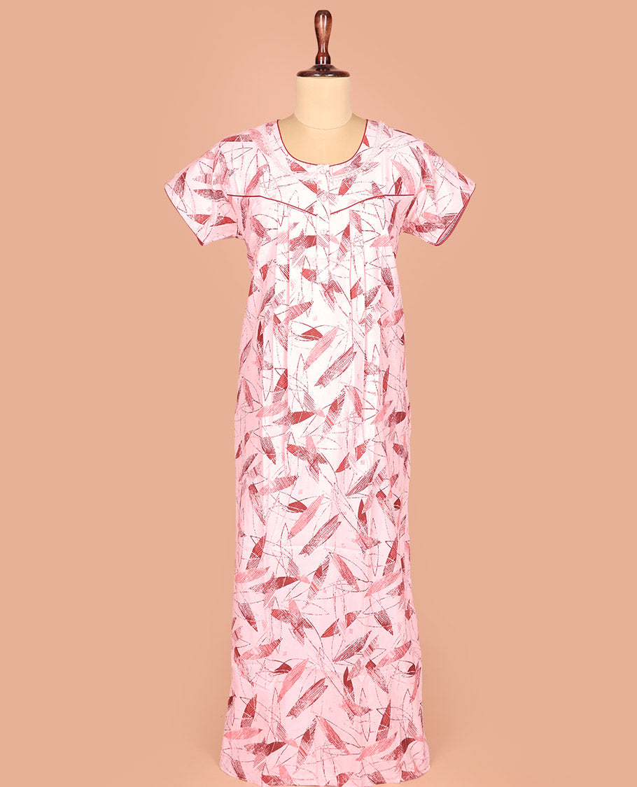 Pale Pink Cotton Nighty Adorned with Geometric Patterns Print, Featuring Neck Lace Work, Round Front Neck, and Half-Sleeves