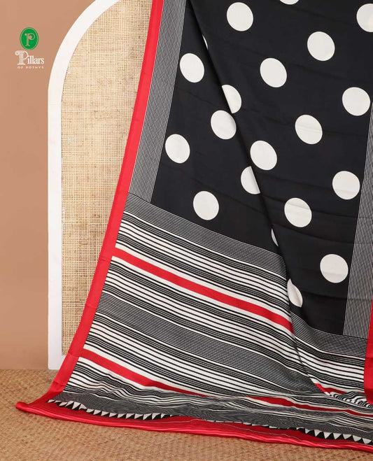 Cream with black polka dot printed gajji silk saree with contrast piping border & printed pallu along with striped printed blouse