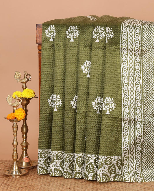 Olive green batik-style tree motif printed litch crushed saree, leaf print border, floral-geometric print pallu & floral print blouse