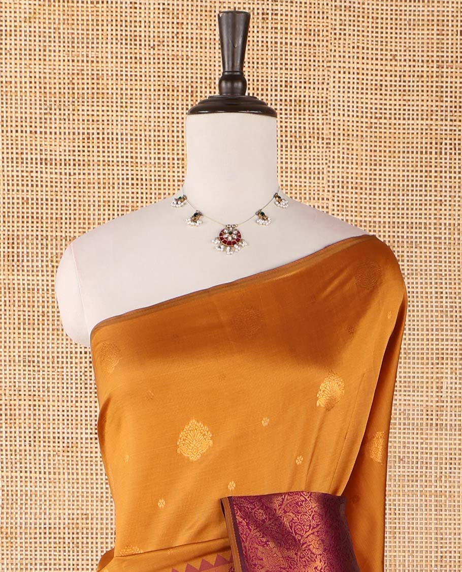 Borderless gold-purple zari buttas & half-&-half vanasingari-style flora-fauna woven kanchi silksaree,self-pallu & blue blouse of zari brocade