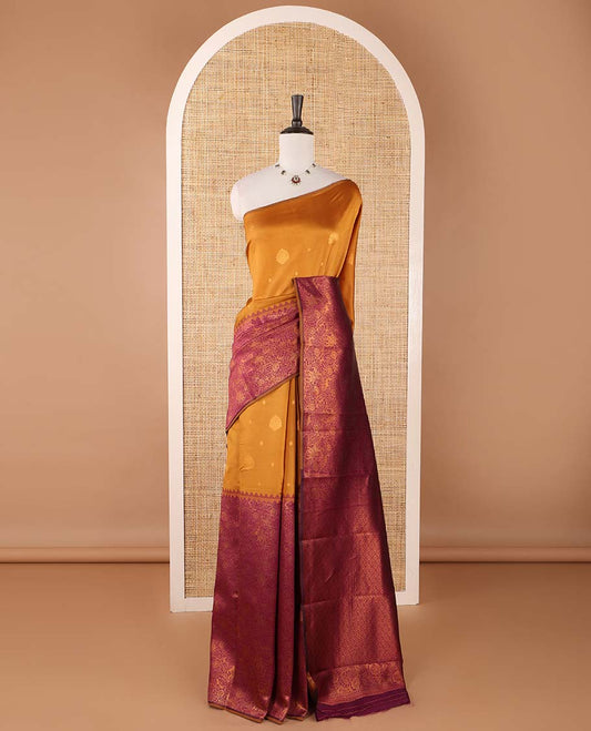 Borderless gold-purple zari buttas & half-&-half vanasingari-style flora-fauna woven kanchi silksaree,self-pallu & blue blouse of zari brocade