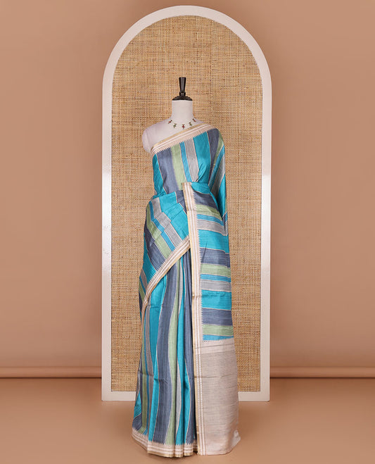 Multi color vertically striped semi-tussar saree, contrast resham thread border of temple and rudraksham motifs, striped pallu, and contrast striped printed blouse