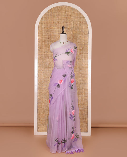 Borderless lavender floral motifs  hand brush painted semi-organza saree comes with tasseled pallu and without blouse