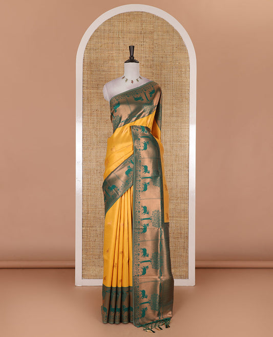 Yellow Pichwai cow zari motifs, Kanchi tissue saree, contrast Pichwai cow motifs copper zari woven border, zari-rich pallu, and contrast zari design blouse