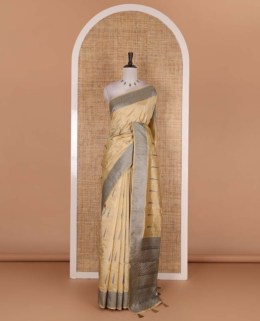 Sandal buttas woven semi-tussar saree, zari border, geometric patterned pallu, and a matching blouse