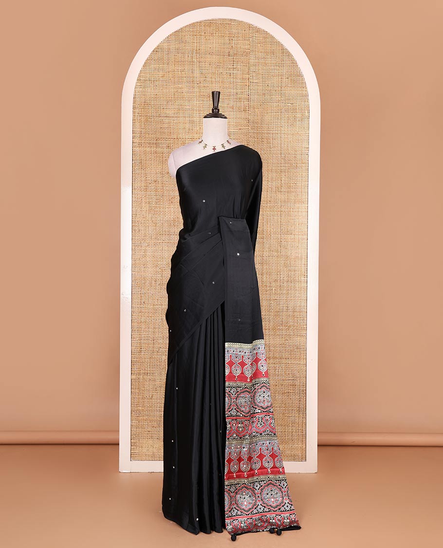 Borderless black mirror work Gaji silk saree, contrast ajrakh-style printed pallu, and intricately printed blouse