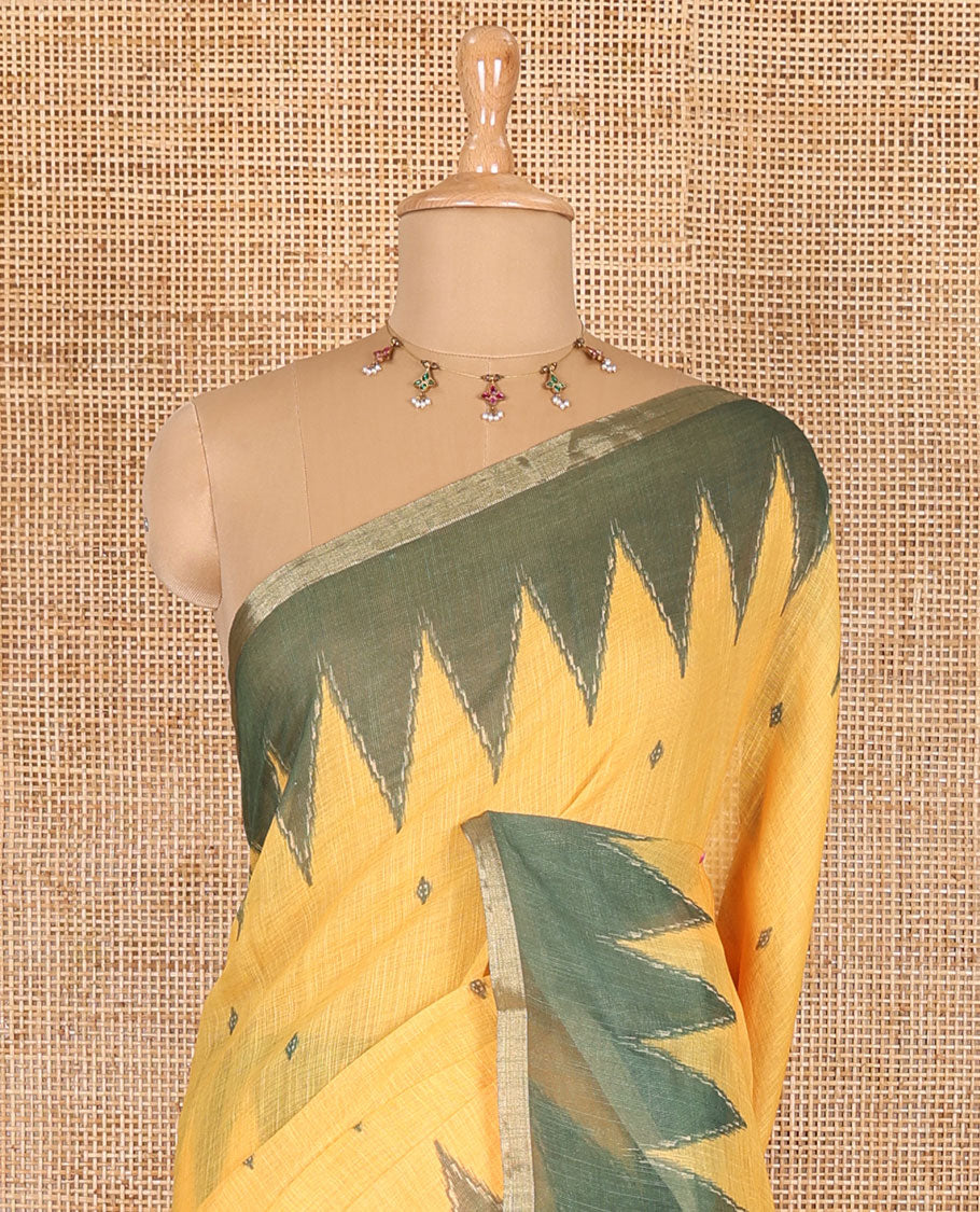 Yellow small thread buttas linen cotton saree, contrast temple zari piping border, striped pallu and a contrast blouse