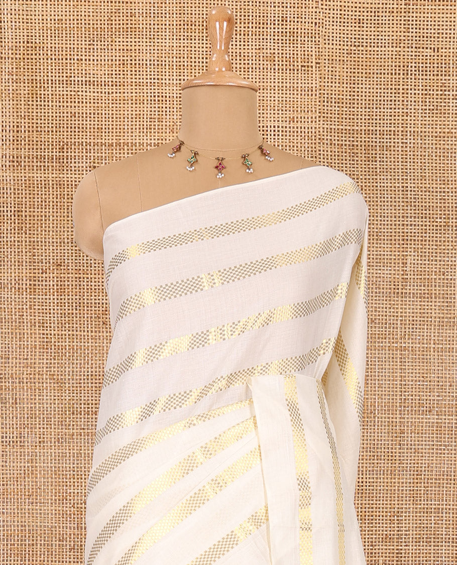 Borderless cream and mustard horizontal muthu zari striped Kerala cotton saree, self-pallu with tassels, and a matching blouse